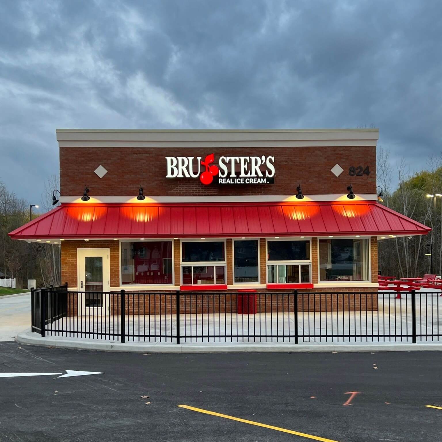 Exterior of Bruster's Ice Cream shop with red awning and sign.