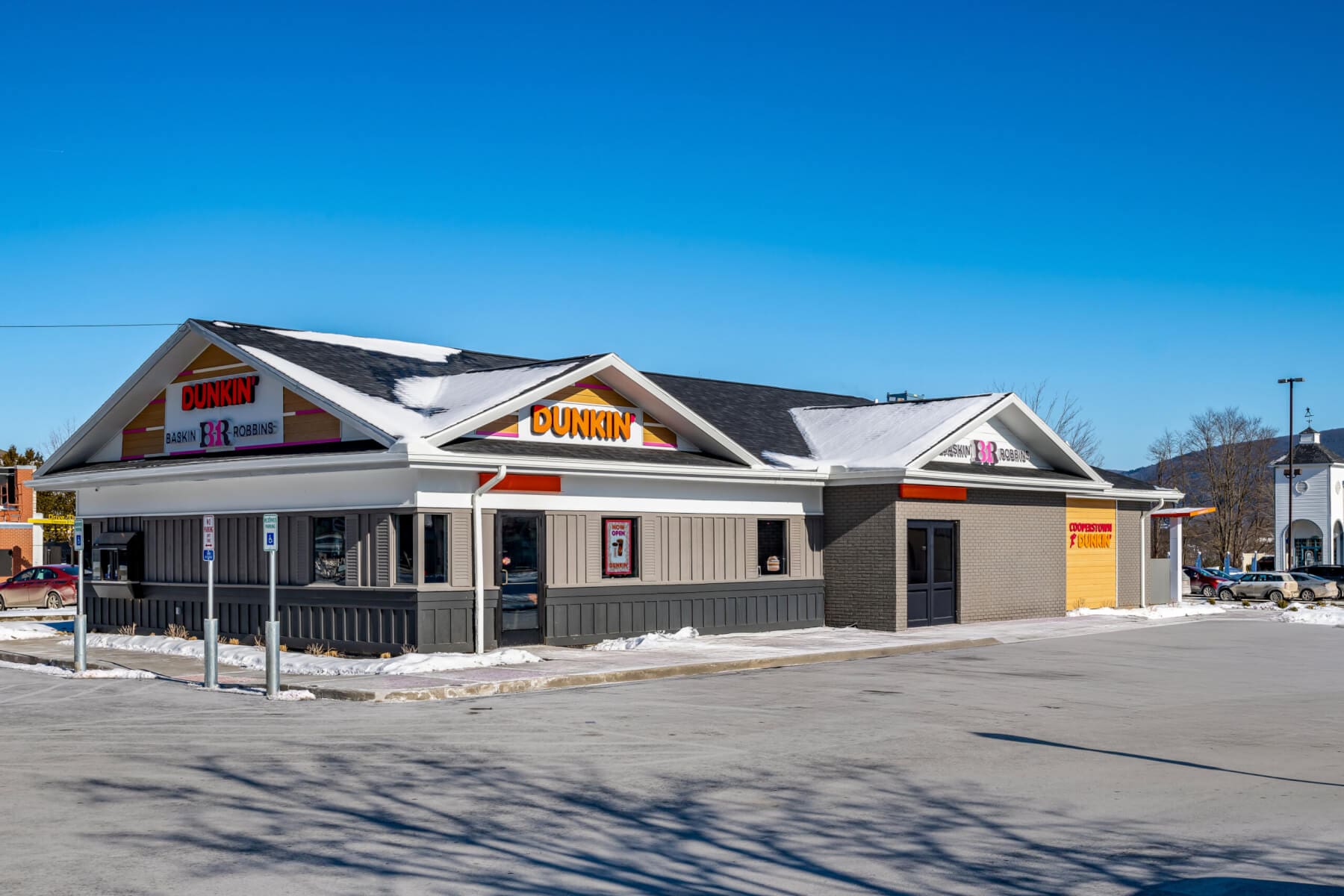 Dunkin' and Baskin-Robbins store exterior with clear blue sky in the background.