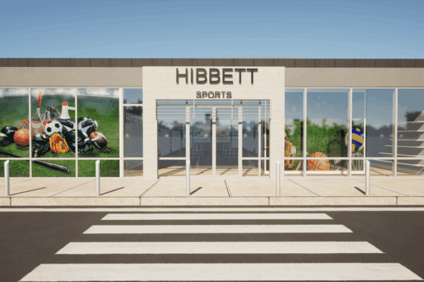 Hibbett Sports storefront showcasing diverse sports gear under bright blue skies.