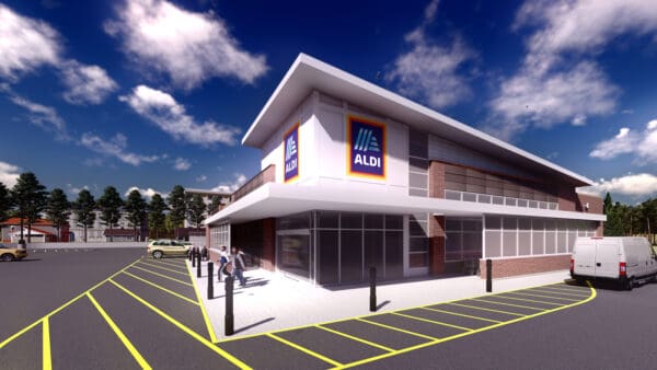 Modern ALDI storefront with customers exiting and parked cars in the lot under a clear blue sky.
