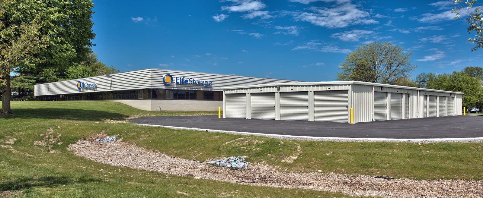 LifeStorage facility exterior with rental units in a landscaped area.