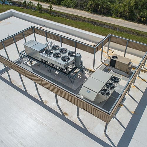 Rooftop commercial HVAC system installation ensures efficient cooling at GreenTech facility.