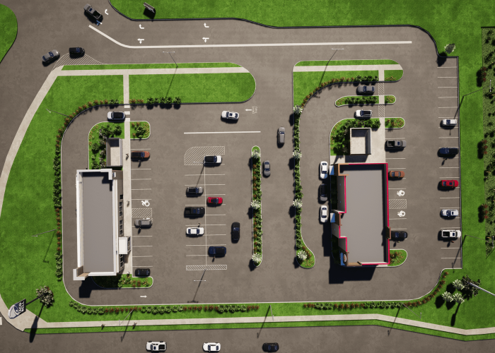 Aerial view of a busy parking lot with two buildings, showcasing efficient layout for easy navigation and accessibility.