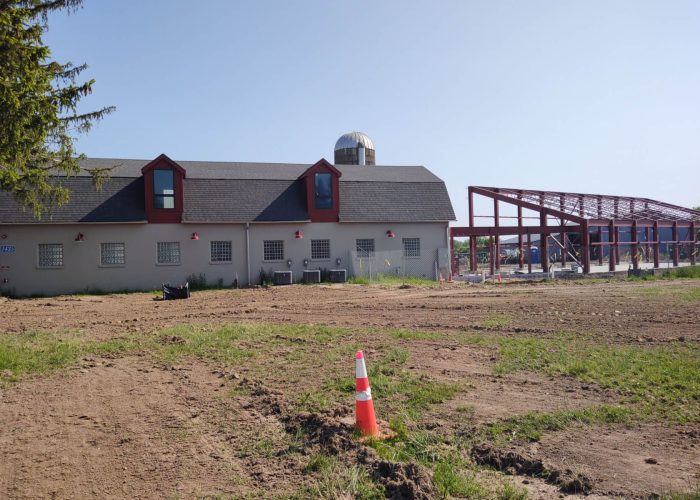 Building under renovation with steel framework and construction site. Enhancing structural renovations for future use.