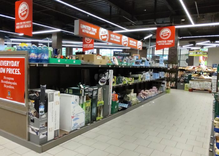 Store aisle with Aldi Finds, promoting limited-time deals and everyday low prices. Explore weekly savings and offers.