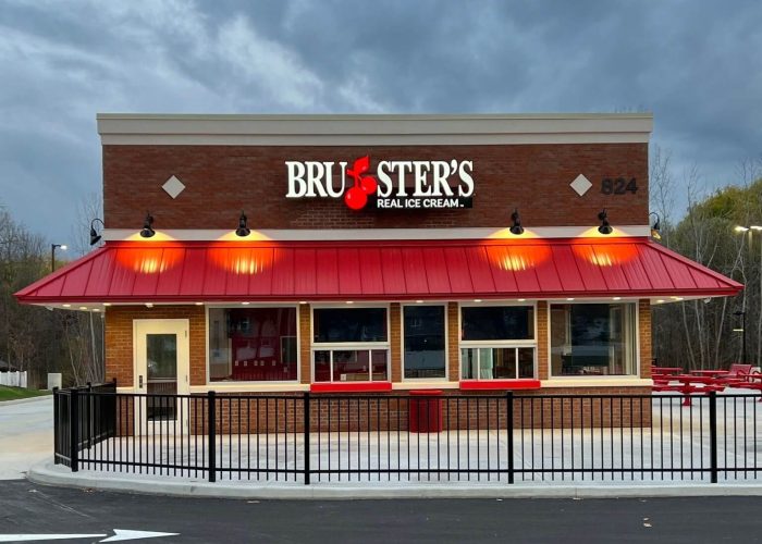New Bruster's Ice Cream store with bright red awning and inviting exterior. Family-friendly ice cream destination.