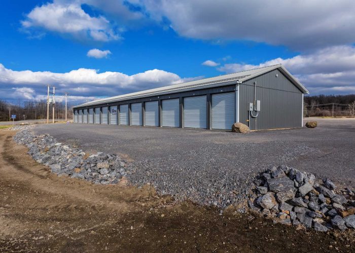 Modern storage facility with multiple secure units on a sunny day, ideal for personal storage solutions.