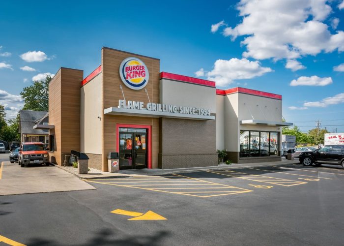Burger King exterior with Flame Grilling Since 1954 sign, showcasing the restaurant's iconic brand.