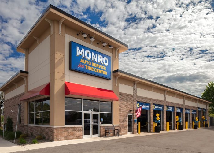 Monro Auto Service and Tire Center storefront with clear blue skies.
