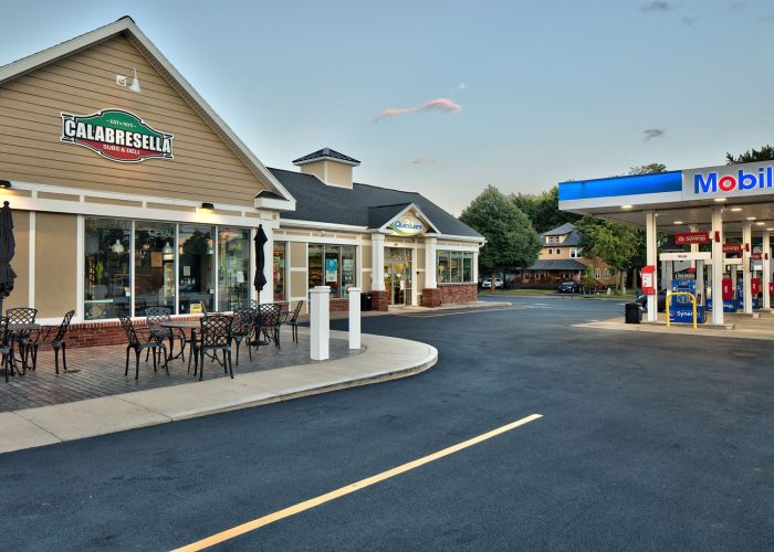 Calabresella Deli and Mobil station exterior with outdoor seating. Ideal stop for a sub and fuel.