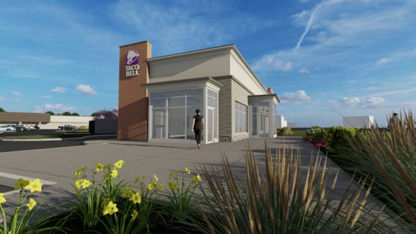 Exterior of Taco Bell with clear skies and landscape.